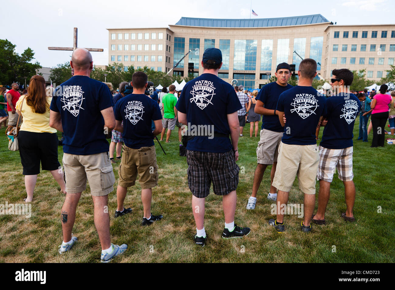 Aurora, CO – Police officers from Dearborn, Michigan were present during a prayer vigil at the Aurora Municipal Building on July 22, 2012. The police officers were in Colorado Springs at an Explorer competition and decided to stay to attend the vigil to express their support for the community. USA. Stock Photo