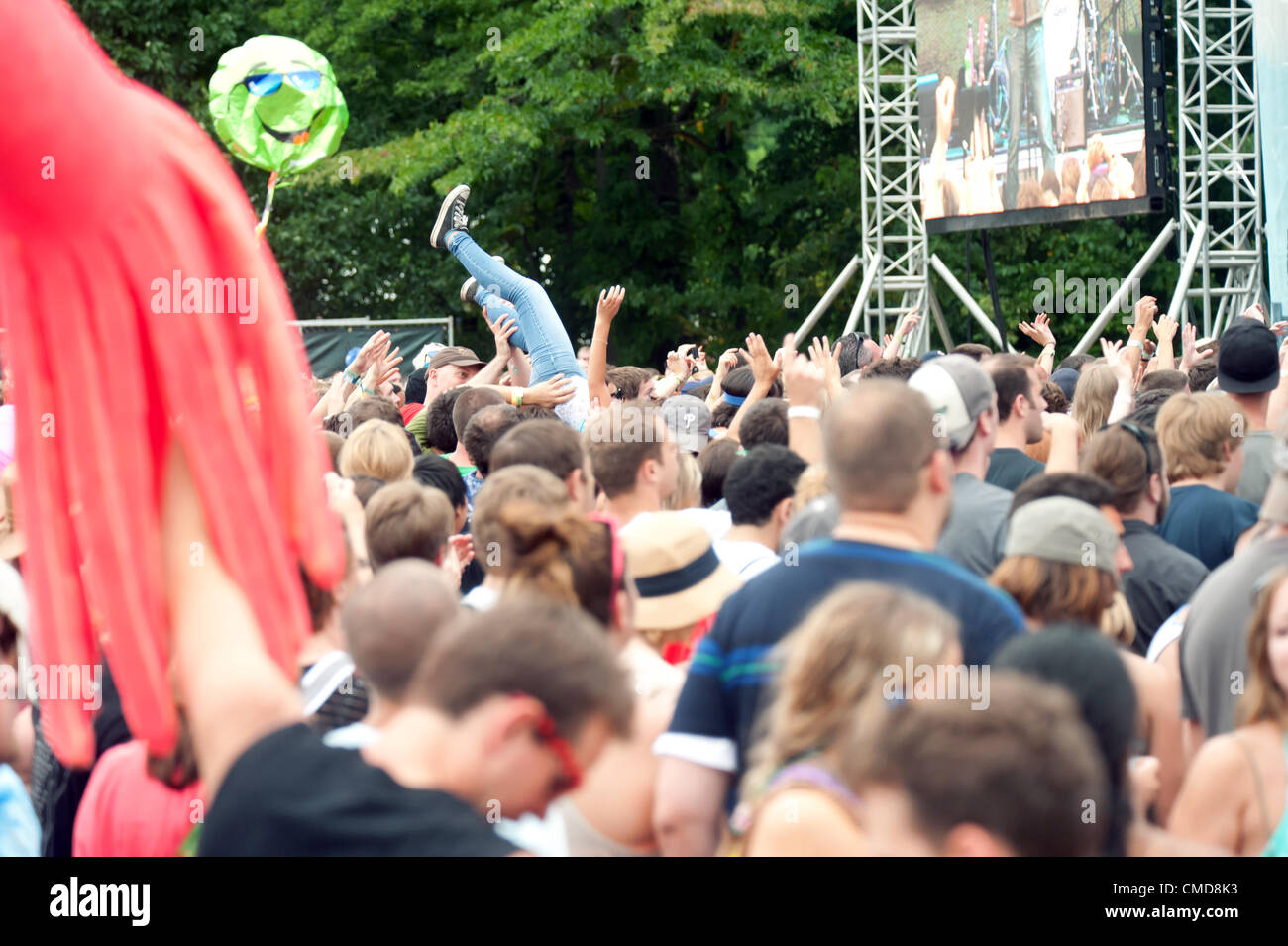 A young girl begins to fall while body / crowd surfing at the Firefly Music Festival in Dover, Delaware, United States Stock Photo