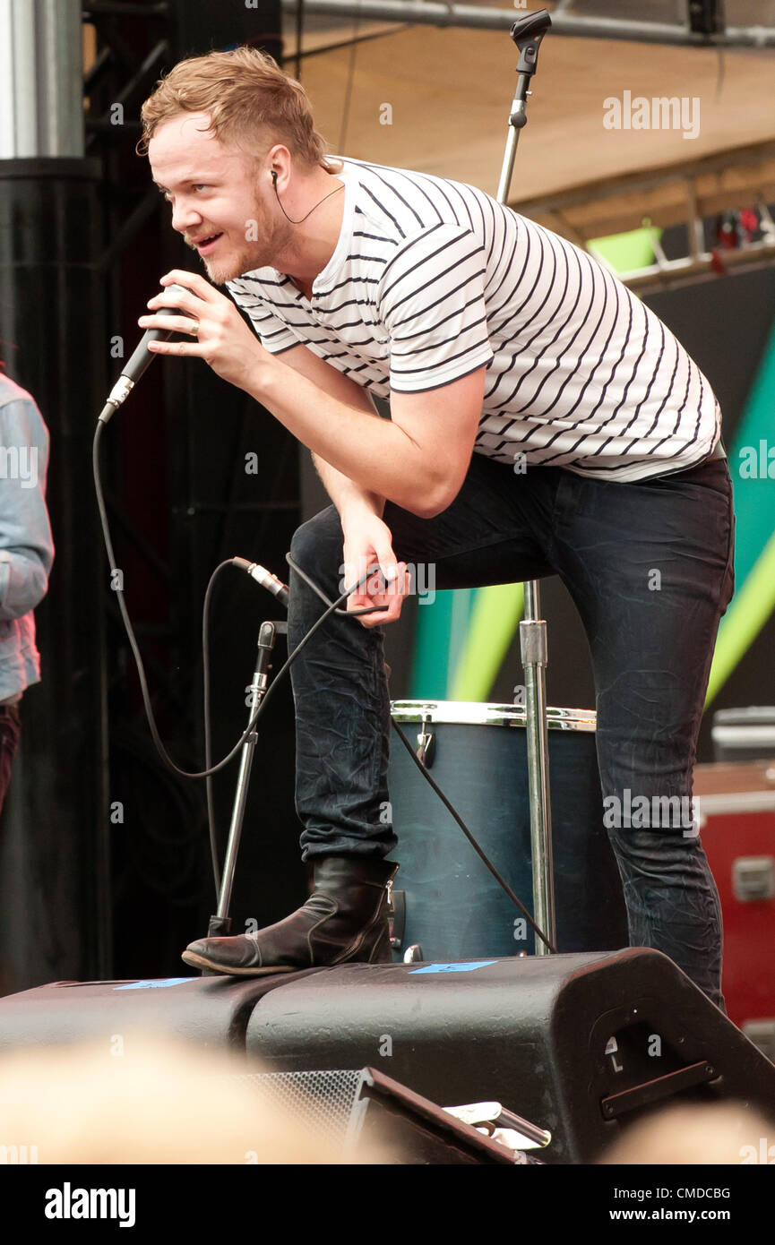 Singer / frontman Rock star / musician Dan Reynolds of the alt rock  indie rock  indy rock band Imagine Dragons | Performing and singing at the original outdoor summer Firefly Alternative Music Festival in 2012 by Red Frog Events | concert venue located in Dover, Delaware, United States Stock Photo