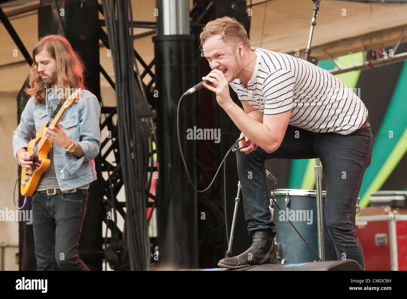 Singer / frontman Rock star / musician Dan Reynolds and Wayne Sermon of the alt rock  indie rock  indy rock band Imagine Dragons | Performing and singing at the original outdoor summer Firefly Alternative Music Festival in 2012 by Red Frog Events | concert venue located in Dover, Delaware, United States Stock Photo