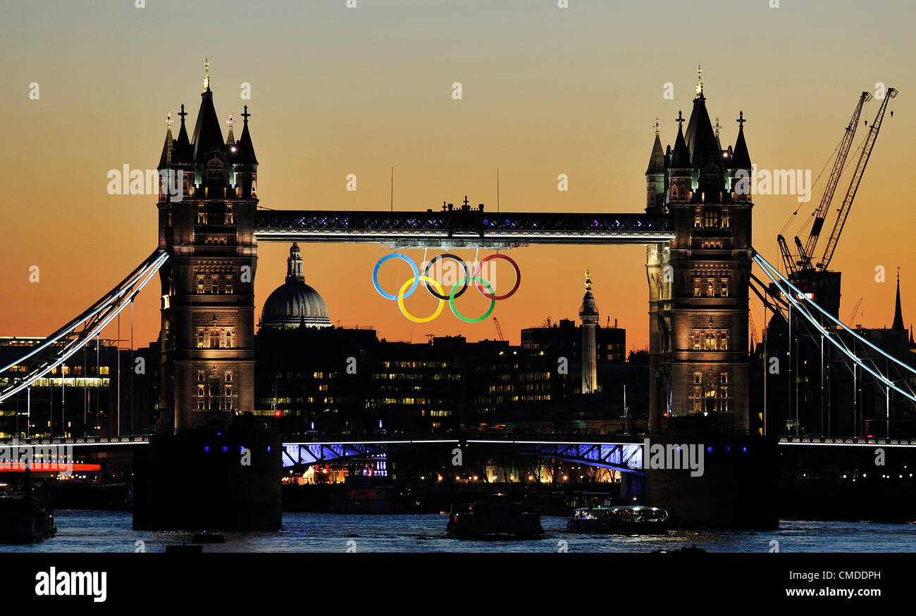 Sunset over London showing Tower bridge & the Olympic rings. July 23 ...