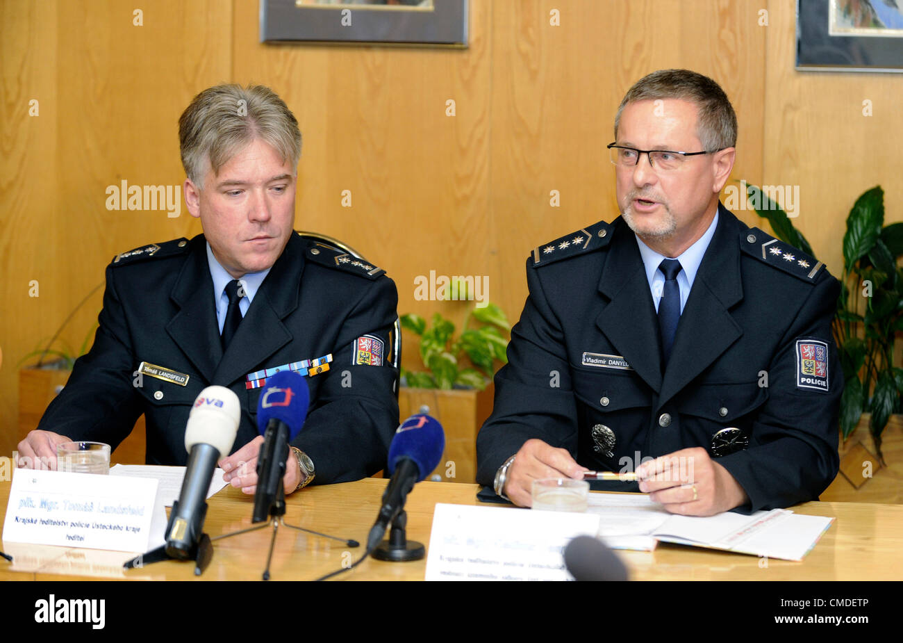 The alleged plan of a family member to swap a Czech baby girl from Trmice near Usti for a house in Germany is only a version of defence of the German woman suspected of the baby´s kidnapping, Czech policemen told reporters today. Pictured regional police chiefs Tomas Lansfeld (left) and Vladimir Danyluk at a press conference in Usti nad Labem, Czech Republic on July 24, 2012. (CTK Photo/Libor Zavoral) Stock Photo