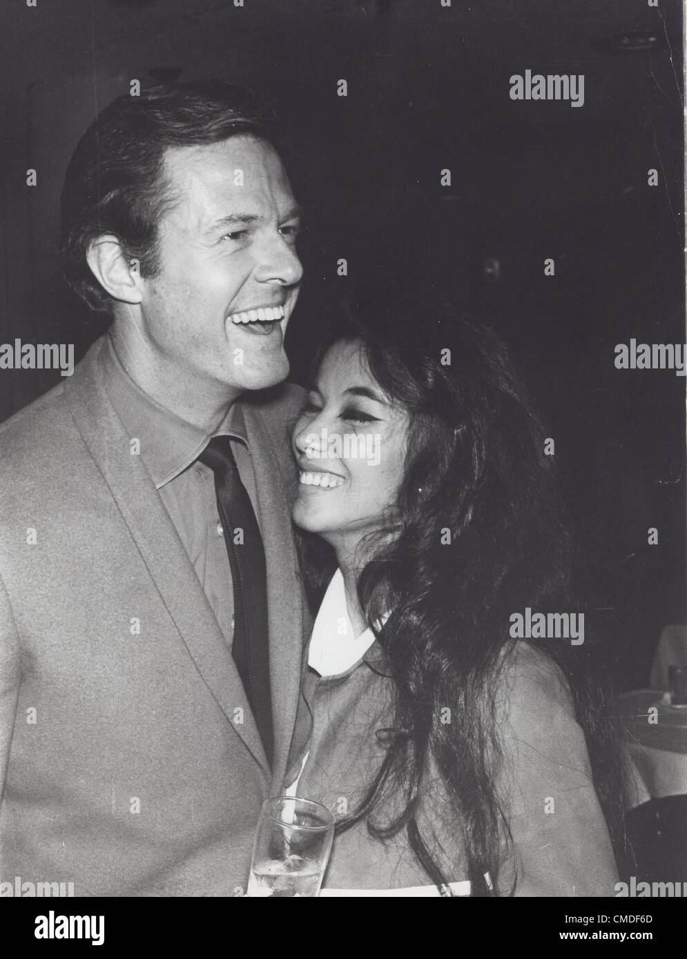 ROBERT CULP with France Nuyen at a cocktail party for the foreign press ...