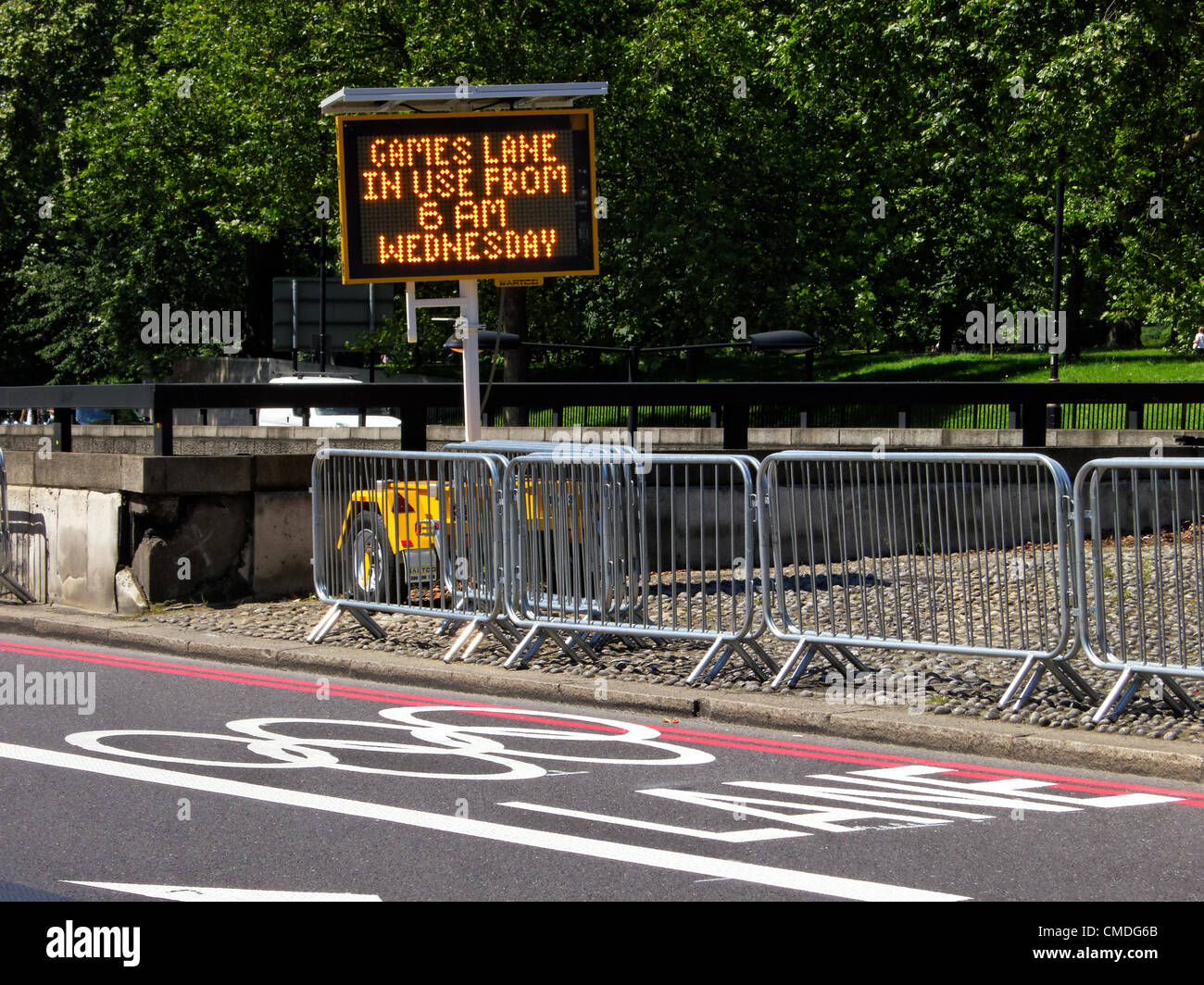 Monday July 23, 2012. Sign warning that the Olympic lanes will be in used starting Wednesday July 25 at 6am. The London 2012 Olympic Games will be officially opened on Friday July 27, 2012 at 9pm. Stock Photo