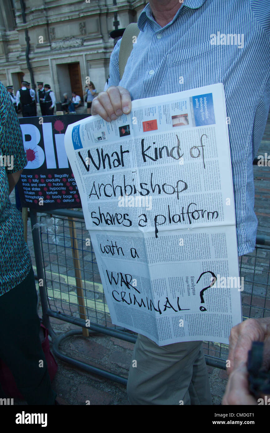 24th July, 2012. London UK. Anti War Protesters in front of Central Hall Westminster during a demonstration against Tony Blair who is sharing a platform with the Archbishop of Canterbury Rowan Williams. The protesters with placards denouncing former British Prime Minister Tony Blair for sending troops to join the 2003 war in Iraq. Stock Photo