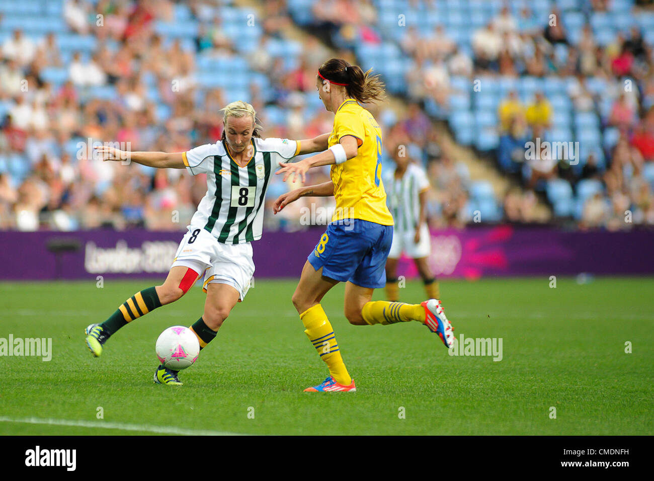 25.07.2012 Coventry, England. Kylie LOUW (South Africa) and Lotta SCHELIN (Sweden) in action during the Olympic Football Women's Preliminary game between Sweden and South Africa from the City of Coventry Stadium Stock Photo