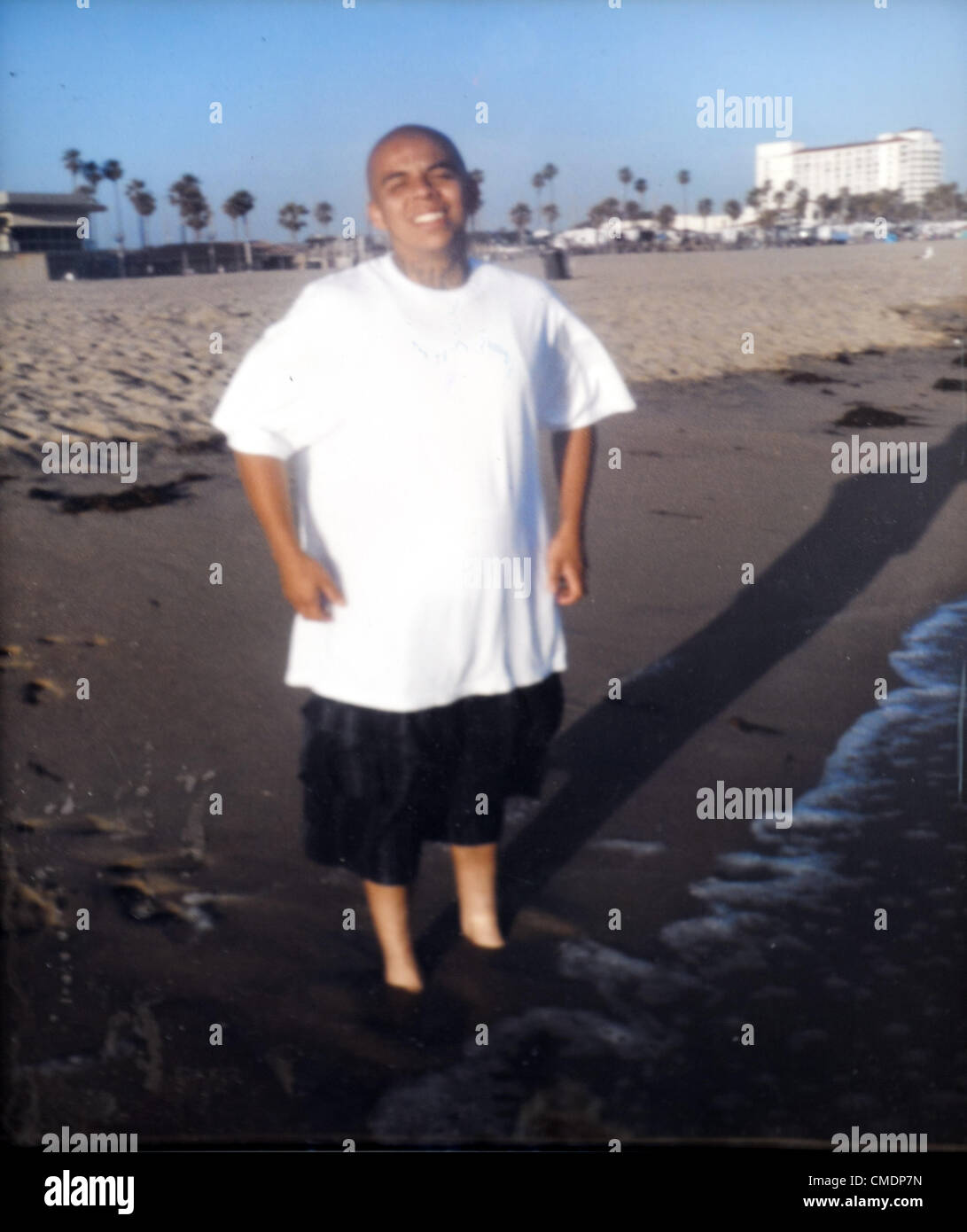 July 25, 2012 - Anaheim, California, U.S. - A photo of Anaheim resident, JOEL ACEVEDO, 23, was on display at a memorial made by friends and family on South Palm Street. In the photo Acevedo was 21 years old. Anaheim resident Joel Acevedo, 23, was shot to death by Anaheim Police after he led them on a short chase, crashed in the stolen car and shot at police at around 11 p.m. on Sunday, July 22, 2012. (Credit Image: © David Bro/ZUMAPRESS.com) Stock Photo