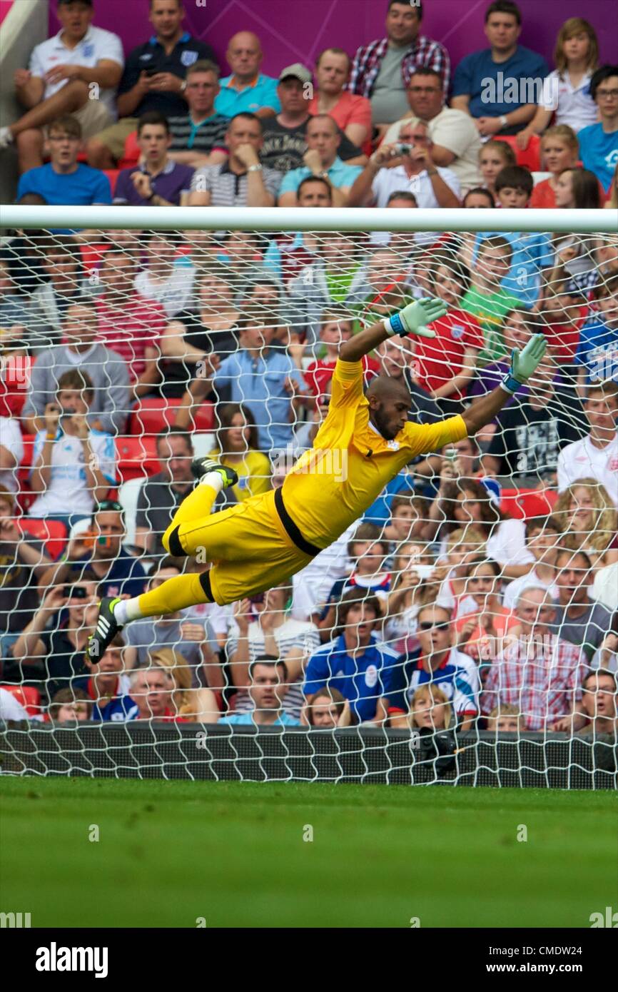 26.07.2012 Manchester, England. United Arab Emirates goalkeeper Ali Khasif is beaten by the free kick of Gaston Ramirez for the Uruguay equaliser during the first round group A mens match between United Arab Emirates and Uruguay at Old Trafford. Stock Photo