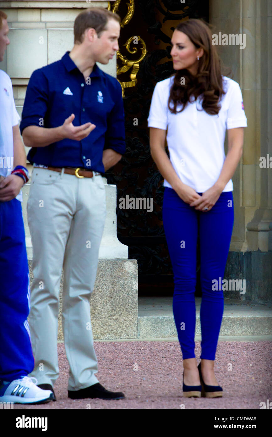 26th July 2012:  Kate Middleton, Prince William and Prince Harry Meet the olympic flame outside Buckingham Palace.  2222 Stock Photo