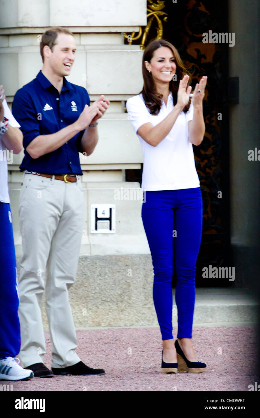 26th July 2012:  Kate Middleton, Prince William and Prince Harry Meet the olympic flame outside Buckingham Palace.  2222 Stock Photo