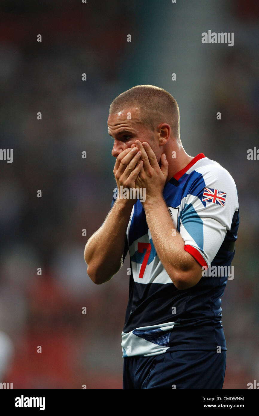 TOM CLEVERLEY TAKES A KNOCK GREAT BRITAIN V SENEGAL OLD TRAFFORD MANCHESTER ENGLAND 26 July 2012 Stock Photo