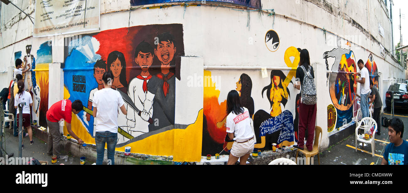 Filipino students paint murals depicting the Philippine Revolution as part of an art competition at the University of the Philippines in Manila, Philippines, 27 July, 2012. The Philippine Revolution occured in 1896 which resulted in the secession of the Philippine Islands from the Spanish Empire. Stock Photo