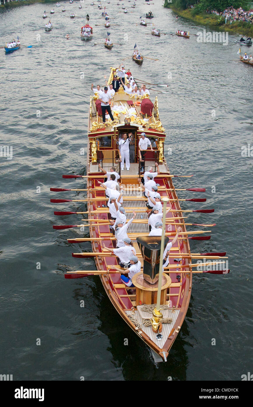 Royal barge Gloriana passes along the Thames through Richmond on its