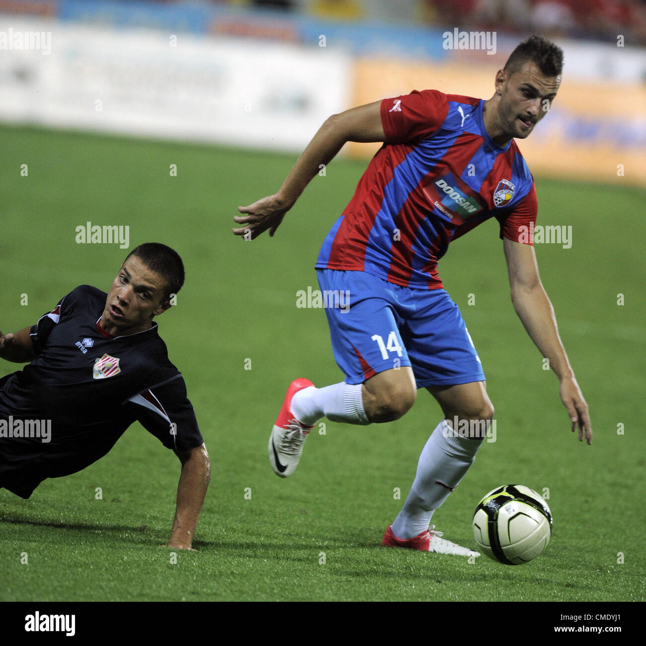 Giorgi Mikaberidze left Of Metalurgi And Radim Reznik Of Plzen In giorgi-mikaberidze-left-of-metalurgi-and-radim-reznik-of-plzen-in