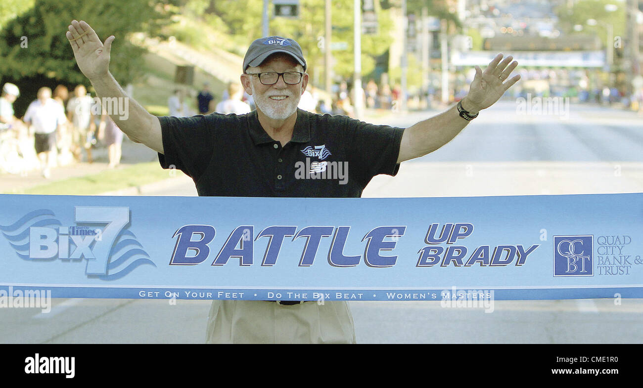 July 26, 2012 - Davenport, Iowa, U.S. - Quad-City Times Bix 7 race director Ed Froehlich poses with the Battle up Brady banner, Thursday, July 26, 2012, shortly before the event begins. (Credit Image: © John Schultz/Quad-City Times/ZUMAPRESS.com) Stock Photo