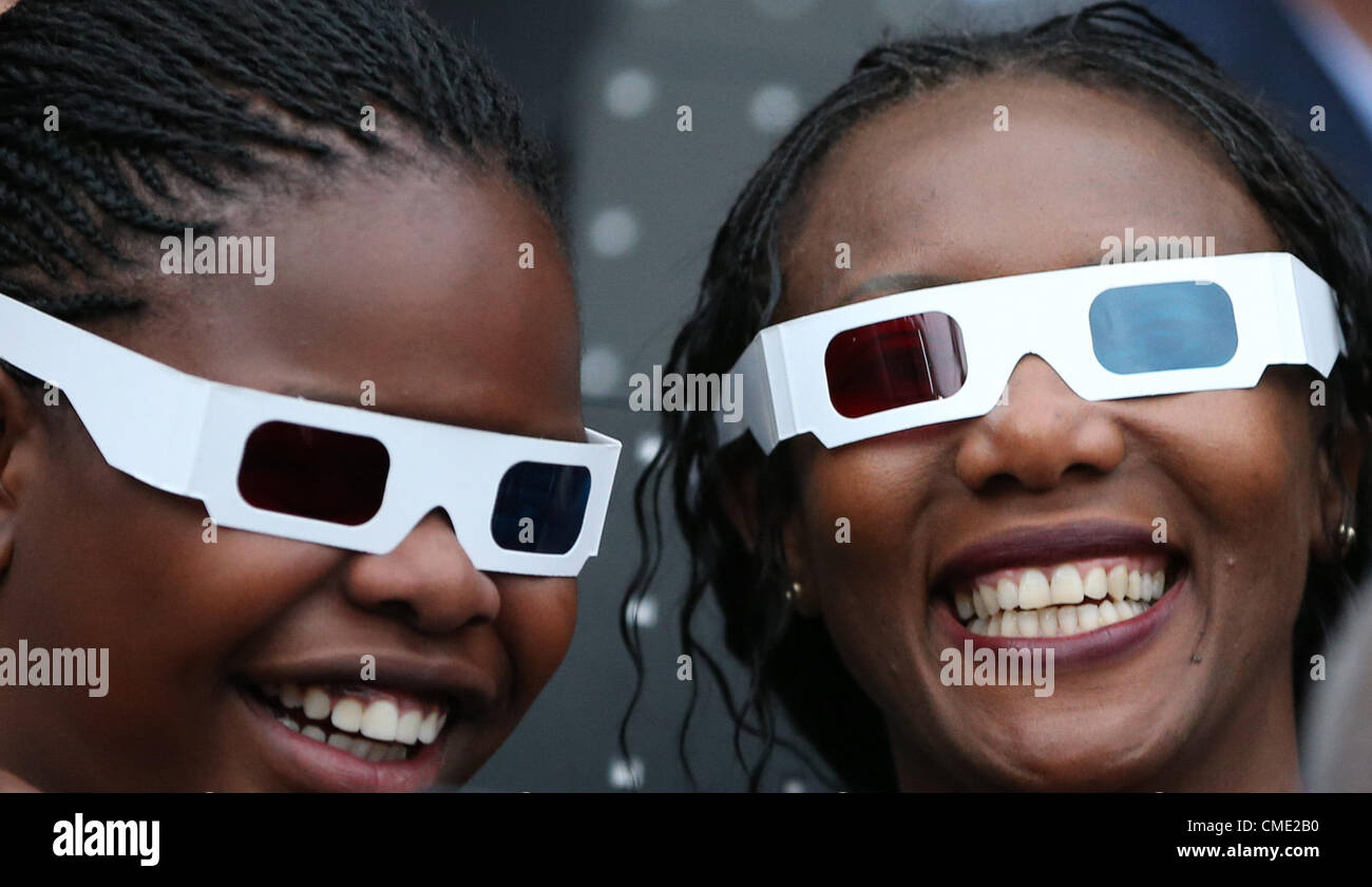 27.07.2012. London England. Two spectators wearing 3D-glasses before the olympic opening ceremony in London, Great Britain, 27 July 2012. The London 2012 Olympic Games will start on 27 July 2012. Stock Photo