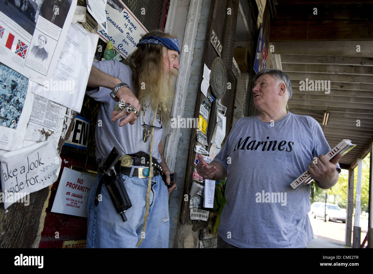 July 25, 2012 - Kennesaw, GA - Often called  'Guntown, USA' this city has had a law on the books for nearly 30 years that requires every homeowner to own a firearm, in hopes of keeping its crime rate low.  Pictured: DENT MYERS, a colorful, outspoken advocate of the law, wears his Colt M1911 45's in plain view at his Civil War relic shop in the center of town. (Credit Image: © Robin Nelson/ZUMAPRESS.com) Stock Photo