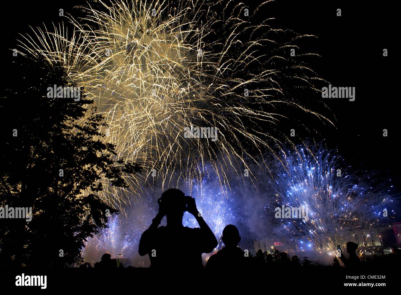 July 27, 2012 - London, England, UK - Dancers who performed in the 2012 London Summer Olympics  observe a fireworks display outside the Olympic Stadium. (Credit Image: © Mark Makela/ZUMAPRESS.com) Stock Photo