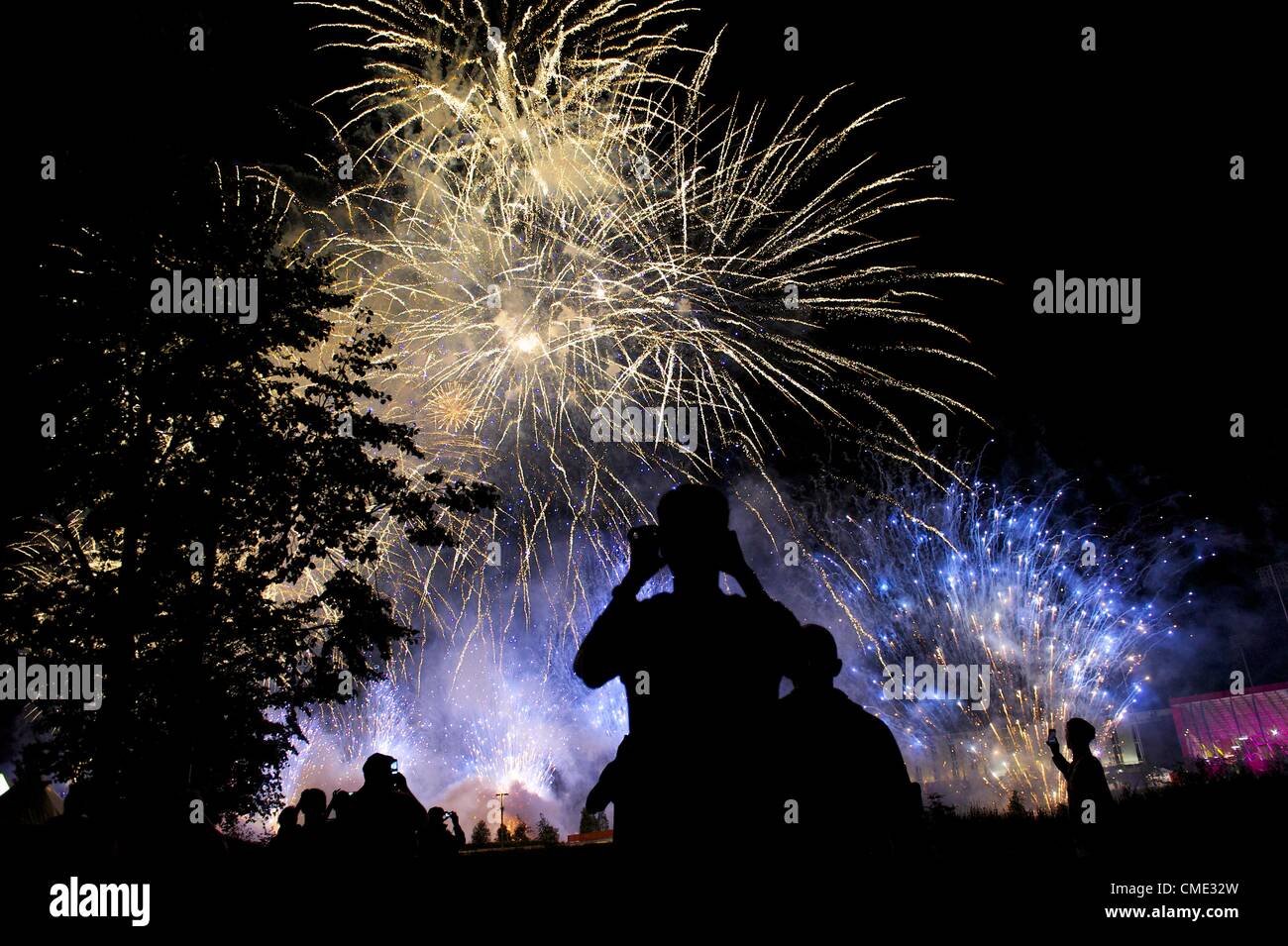 July 27, 2012 - London, England, UK - Dancers who performed in the 2012 London Summer Olympics  observe a fireworks display outside the Olympic Stadium. (Credit Image: © Mark Makela/ZUMAPRESS.com) Stock Photo