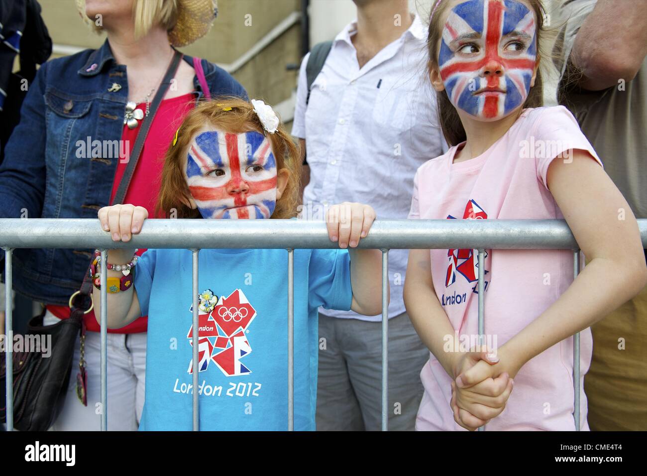 July 28, 2012 - London, England, UK - With faces painted as the Union Jack flag, sisters AMELIE, 4, and LAUREN CHANT, 6, await the arrival of the horses guard on Whitehall. (Credit Image: © Mark Makela/ZUMAPRESS.com) Stock Photo