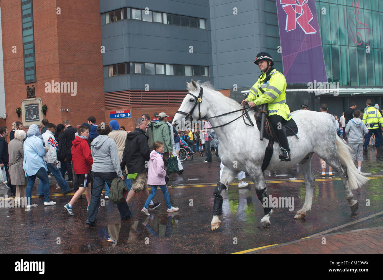 A police-officer on horseback is on duty outside Old Trafford, Manchester United's ground, where Olympic Football matches  will be played later in the afternoon.Brazil v Belarus will be followed by Egypt v New Zealand. Manchester, UK 29-07-2012 Stock Photo