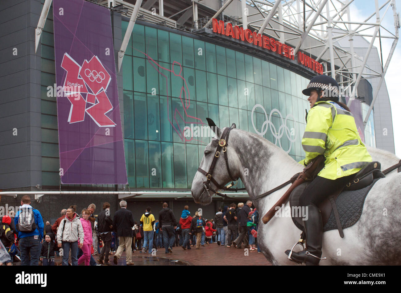 A police-officer on horseback is on duty outside Old Trafford, Manchester United's ground, where Olympic Football matches  will be played later in the afternoon.Brazil v Belarus will be followed by Egypt v New Zealand. Manchester, UK 29-07-2012 Stock Photo