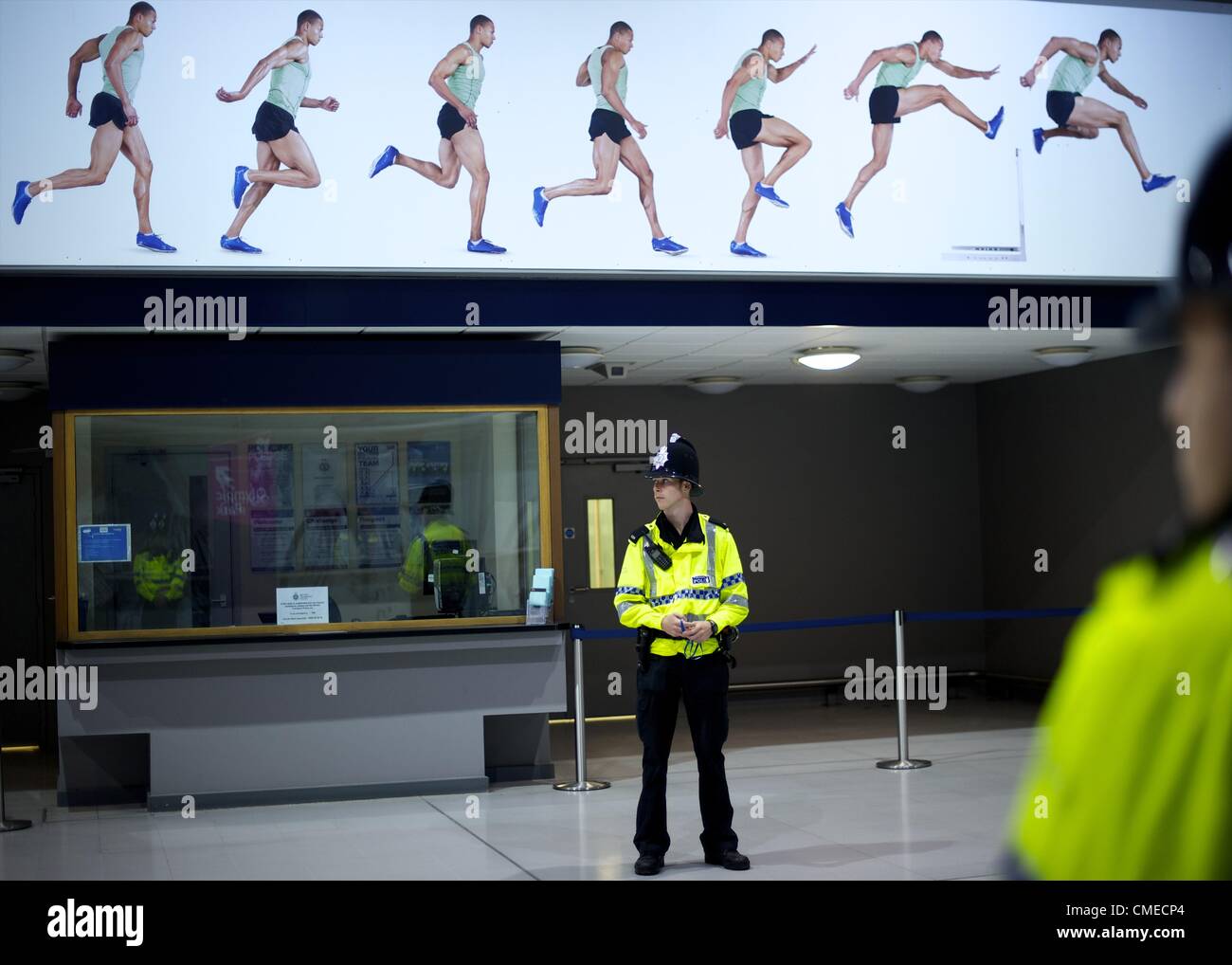 July 29, 2012 - London, England, United Kingdom - Police monitor activity late night at Stratford Station on the third day of the 2012 London Summer Olympics. (Credit Image: © Mark Makela/ZUMAPRESS.com) Stock Photo