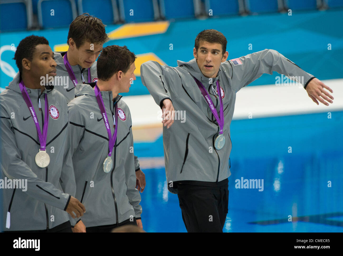 July 29, 2012 - London, England, United Kingdom - Silver medalists, Michael Phelps (USA) demonstrate his butterfly tech to Ryan Lochte , Adrian Nathan and Cullen Jones after the medal ceremony in the Men's 4 x 100m Freestyle Relay at the Aquatics Center on July 29, 2012 in London, United Kingdom. (Credit Image: © Paul Kitagaki Jr./ZUMAPRESS.com) Stock Photo
