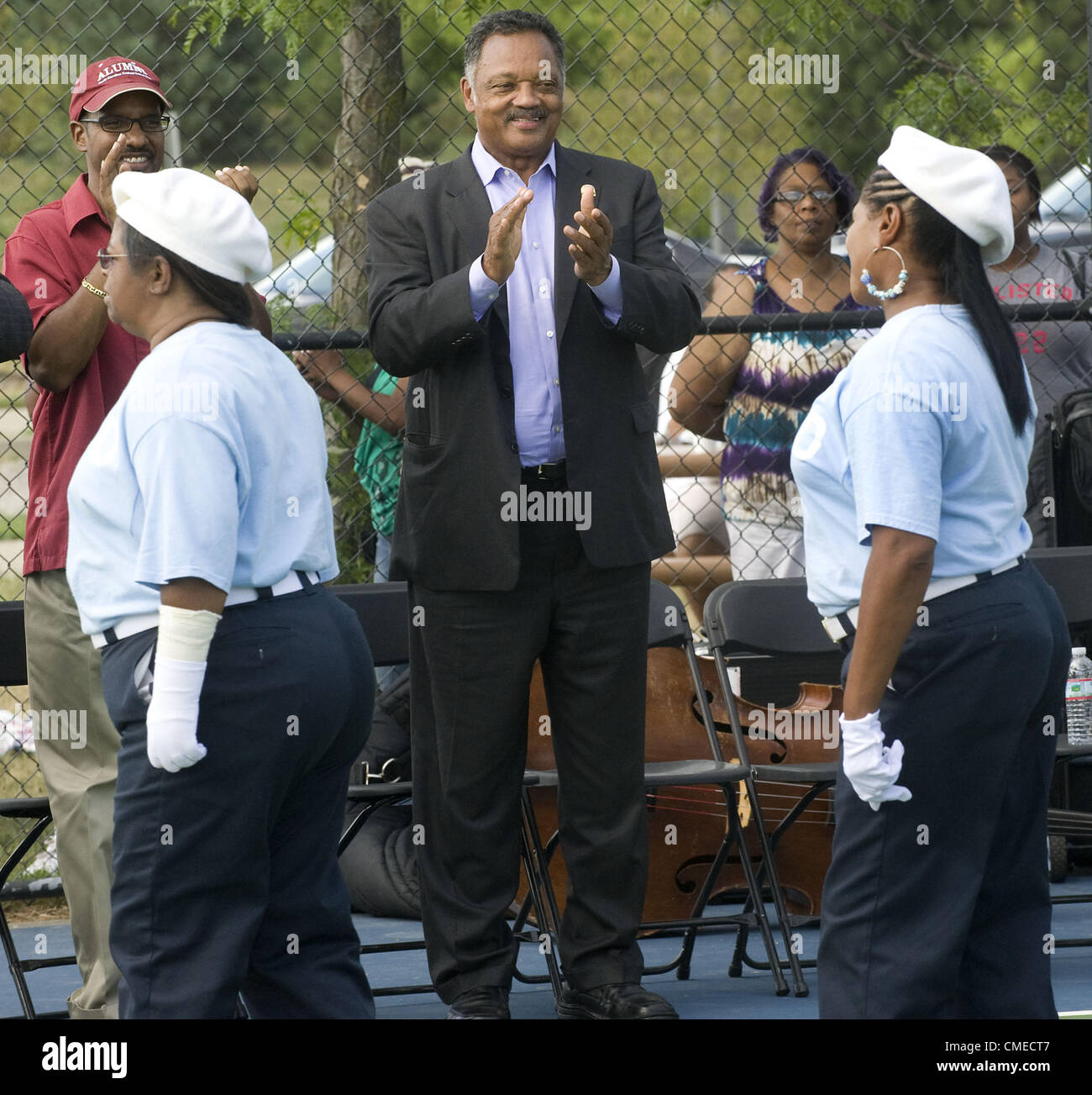 July 29, 2012 - Ann Arbor, Michigan, U.S - The Rev. Jesse Jackson watches the French Dukettes perform while campaigning for  Christina Montague, who's running for Washtenaw County Commissioner, District 7, in Ann Arbor, MI on July 29, 2012.  Jackson used the opportunity to comment on national issues as well.  ''Guns are for hunting,'' he said, pushing for a ban on assault weapons.  ''We bailed out the banks and now we got to bail out the people,'' he said.  ''Hands that once picked cotton can now pick commissioners and judges and presidents,'' said Jackson. (Credit Image: © Mark Bialek/ZUMAPRE Stock Photo