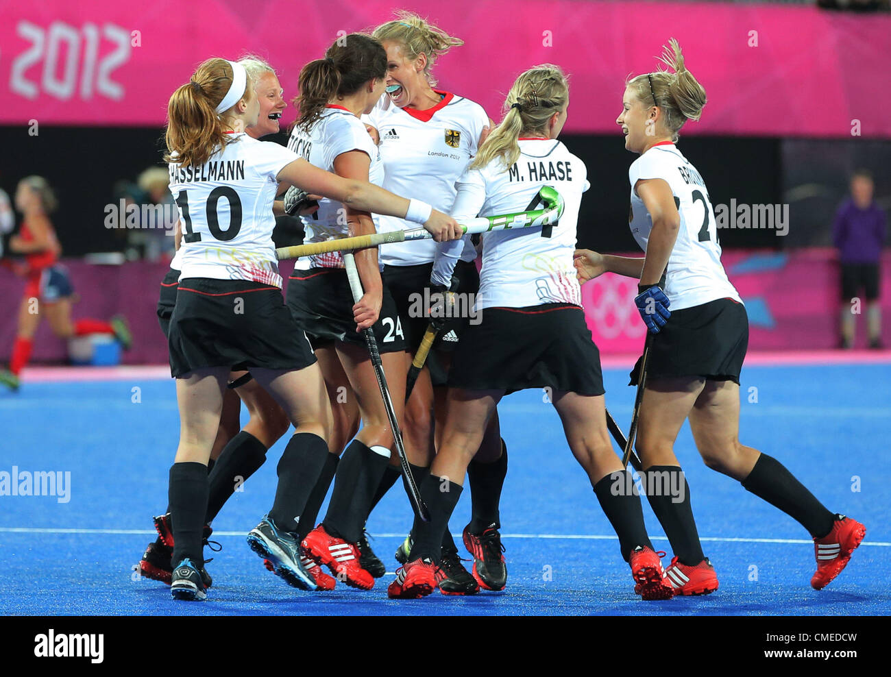 29.07.2012. London, England. Fanny Rinne (C) of Germany celebrates with teammates after scoring against the US team during women's field hockey at Olympic Park Riverbank Arena for the London 2012 Olympic Games Field Hockey competition in London, Britain, 29 July 2012. Stock Photo