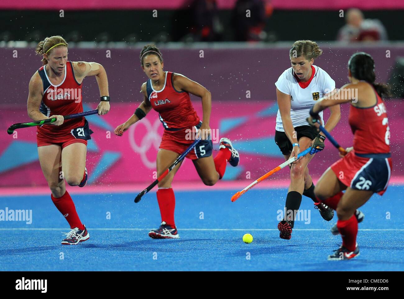29.07.2012. London, England. Germany's Natascha Keller (2nd R) competes with Claire Laubach (L), Melissa Gonzalez (2nd L) and Kayla Bashore Smedley (R) of United States during women's field hockey at Olympic Park Riverbank Arena for the London 2012 Olympic Games, London, Britain, 29 July 2012. Stock Photo