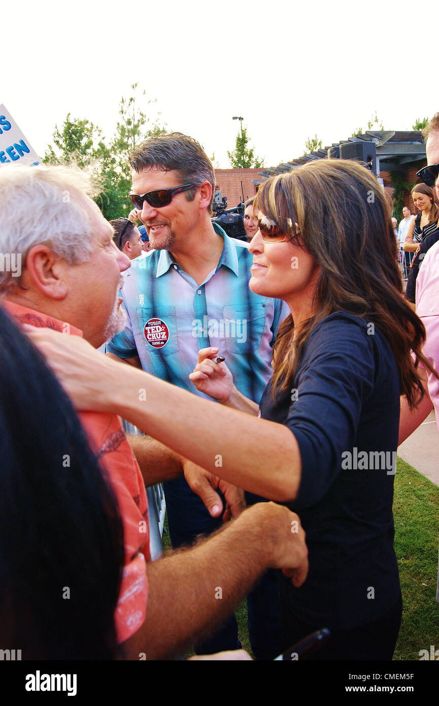 Ted Cruz for US Senate Event at Town Green Park in the Woodlands,Texas on 07/27/2012.Approximately 600 people attended the event.Former Alaska Governor and Fox Commentator Sarah Palin greets supporter Chip Moses with her husband Todd. Stock Photo