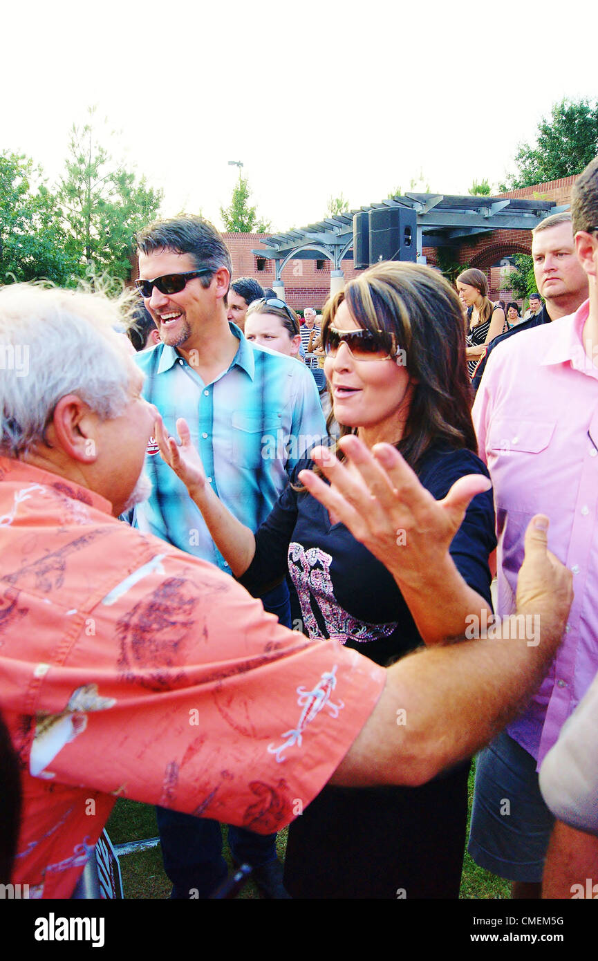Ted Cruz for US Senate Event at Town Green Park in the Woodlands,Texas on 07/27/2012.Approximately 600 people attended the event.Former Alaska Governor and Fox Commentator Sarah Palin greets supporter Chip Moses with her husband Todd . Stock Photo