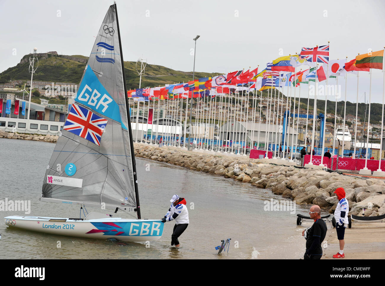 Ben Ainslie brings his Finn Class yacht ashore. Olympic sailing at
