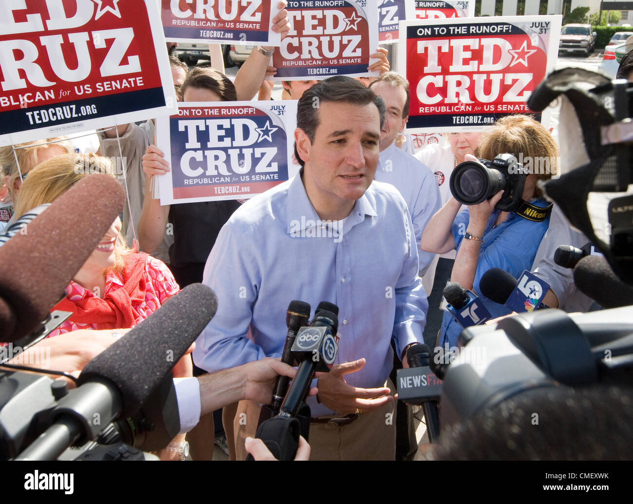 Tea Party US Senate candidate Ted Cruz greets supporters and the press outside a polling place in Houston July 31, 2012 Stock Photo