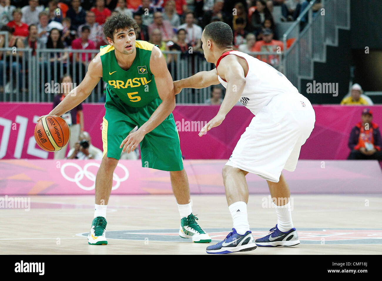 31.07.2012. London, England. 2012 Olympic  Basketball tournament.  Brazil Raul Neto looks to pass the ball during 67-62 Team Brazil victory over Team Great Britain, during the men's basketball preliminary, at the Basketball Arena, in London, Great Britain. Stock Photo