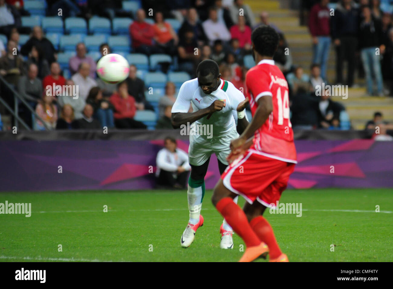 01.08.2012 Coventry, England. Moussa KONATE (Senegal) heads the equaliser and celebrates during the Olympic Football Men's Preliminary game between Senegal and United Arab Emirates from the City of Coventry Stadium Stock Photo