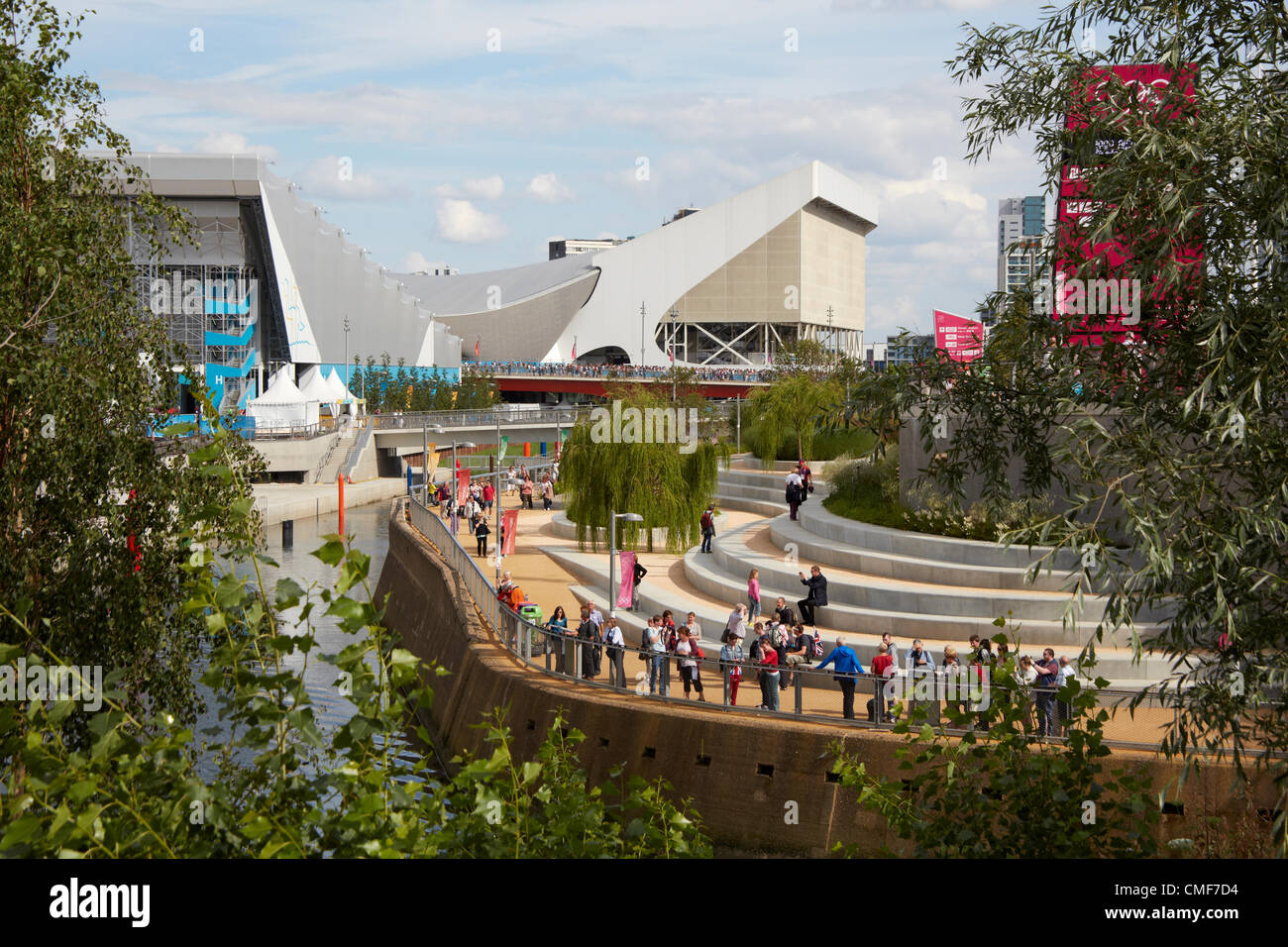 View south along River Lea with Aquatics Centre on a sunny day at Olympic Park, London 2012 Olympic Games site, Stratford London E20 UK, Stock Photo
