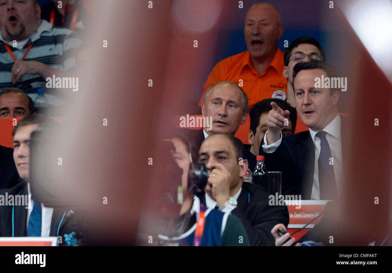 Russian President Vladimir Putin (centre) and British Prime Minister David Cameron watch the men's 100-kg judo competition at the 2012 Summer Olympics, London, Britain, on Thursday, August 2, 2012. (CTK Photo/Michal Kamaryt) Stock Photo