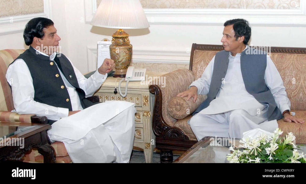 Prime Minister, Raja Pervez Ashraf talks with Professional and Technical  Training Minister, Sheikh Waqas Akram during meeting at PM House in  Islamabad on Monday, September 03, 2012 Stock Photo - Alamy