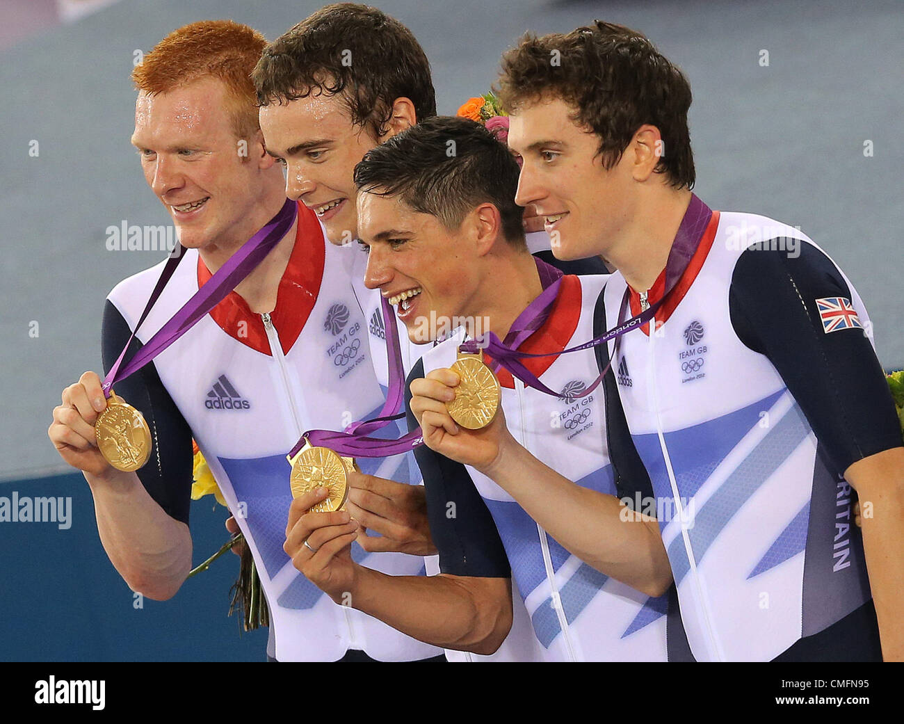 03.08.2012. London England. Great Britain's gold medalists Edward Clancy, Geraint Thomas, Steven Burke and Peter Kennaugh pose on the podium after winning the London 2012 Olympic Games men's team pursuit track cycling event at the Veldorome during the London 2012 Olympic Games, London, Great Britain, 03 August 2012. Stock Photo