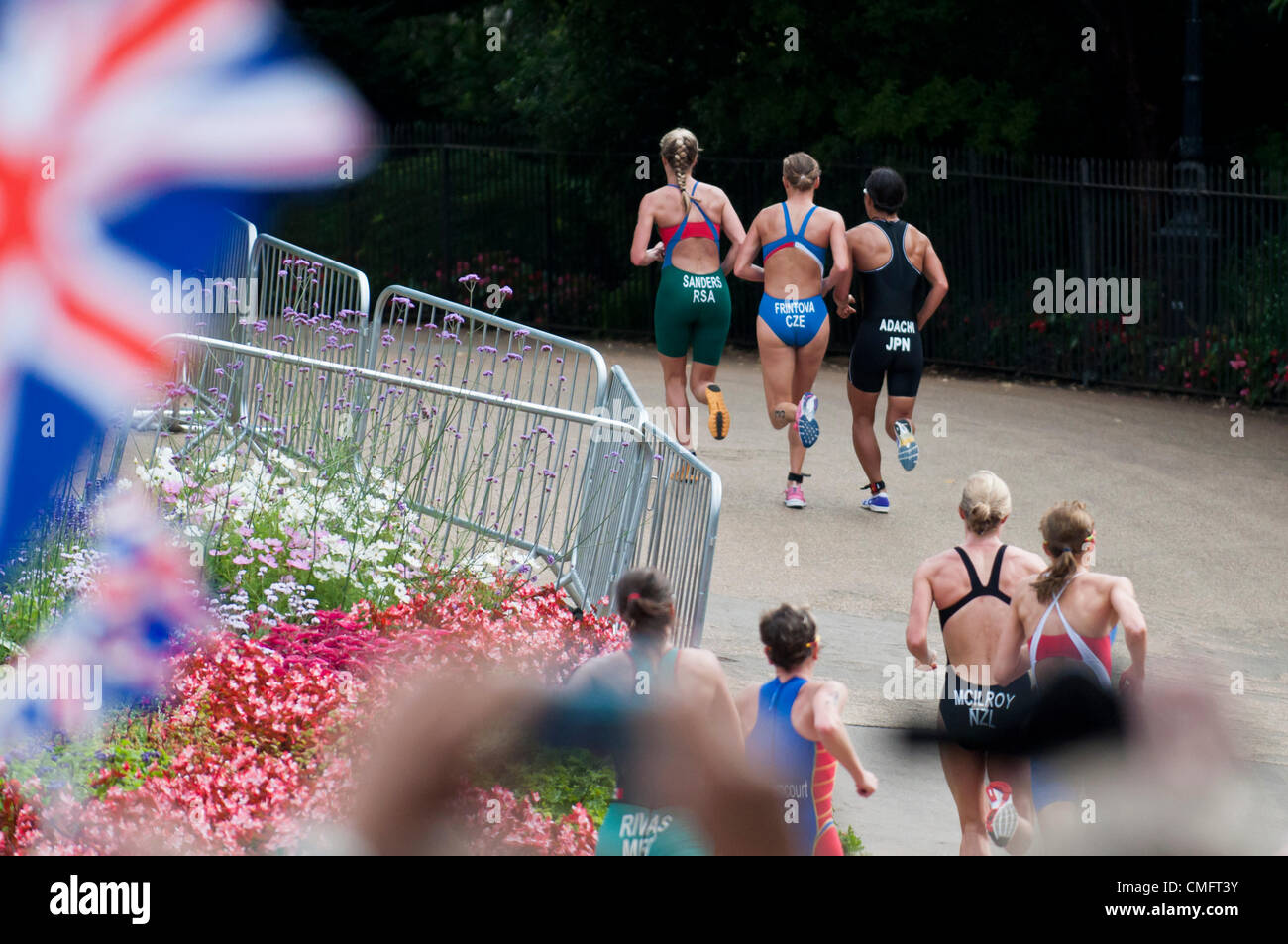 London, UK, Saturday 4th August 2012.  The chase group of the women's triathlon, including lead by South Africa's Gillian Sanders, run up a hill in London's Hyde Park in the final 10k run of the race. The race was finally won by Switzerland's Nicola Spirig, picking up gold, with Sweden's Lisa Norden placing second and the silver medal and Australia's Erin Densham placing third and the bronze. Stock Photo