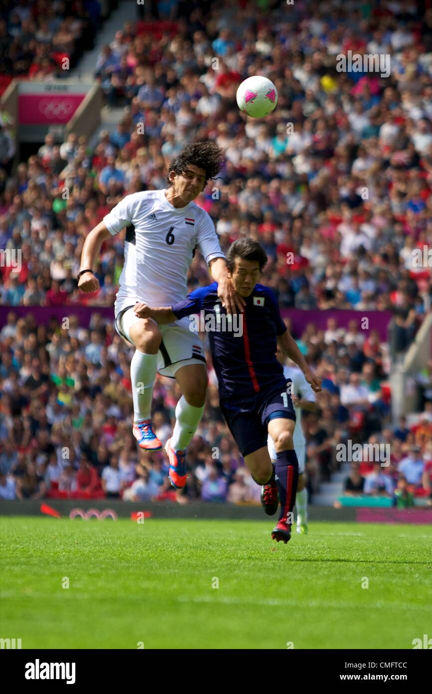 UK. 04.08.2012 Manchester, England. Egypt defender Ahmed Hegazy and Japan forward Kensuke Nagai in action during the quarter final match between Japan and Egypt at Old Trafford. Japan won the game by a score of 3-0 to proceed to the tournament semi-finals. Stock Photo