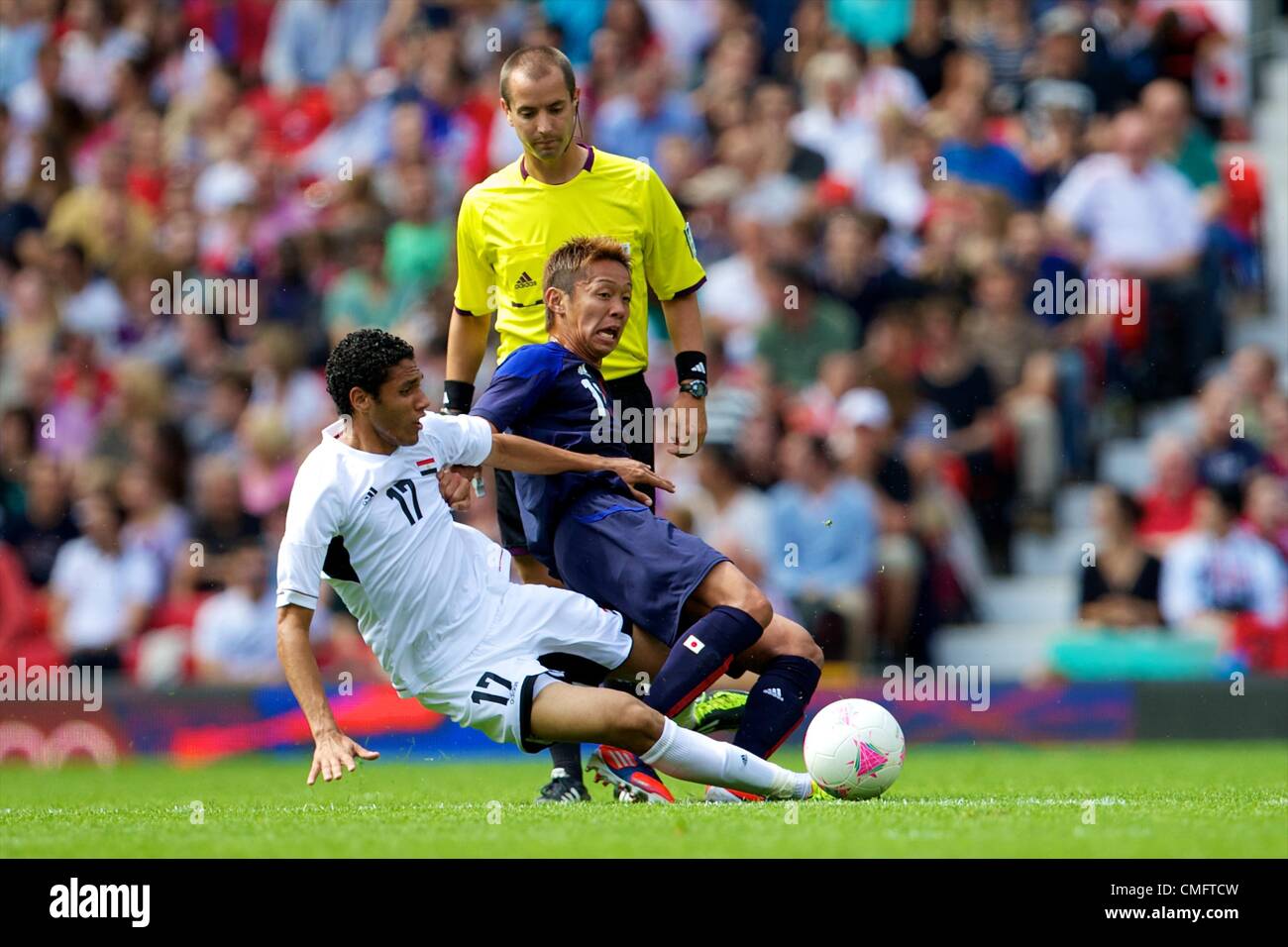 UK. 04.08.2012 Manchester, England. Japan midfielder Hiroshi Kiyotake and Egypt midfielder Mohamed El-Nenny in action during the quarter final match between Japan and Egypt at Old Trafford. Japan won the game by a score of 3-0 to proceed to the tournament semi-finals. Stock Photo