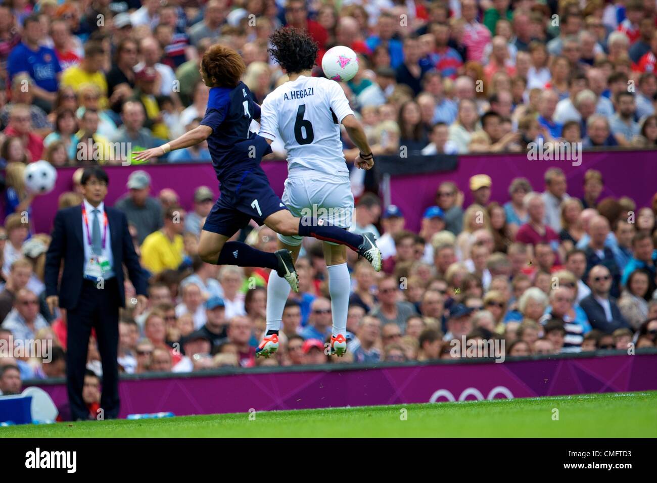 UK. 04.08.2012 Manchester, England. Egypt defender Ahmed Hegazy and Japan forward Yuki Otsu in action during the quarter final match between Japan and Egypt at Old Trafford. Japan won the game by a score of 3-0 to proceed to the tournament semi-finals. Stock Photo