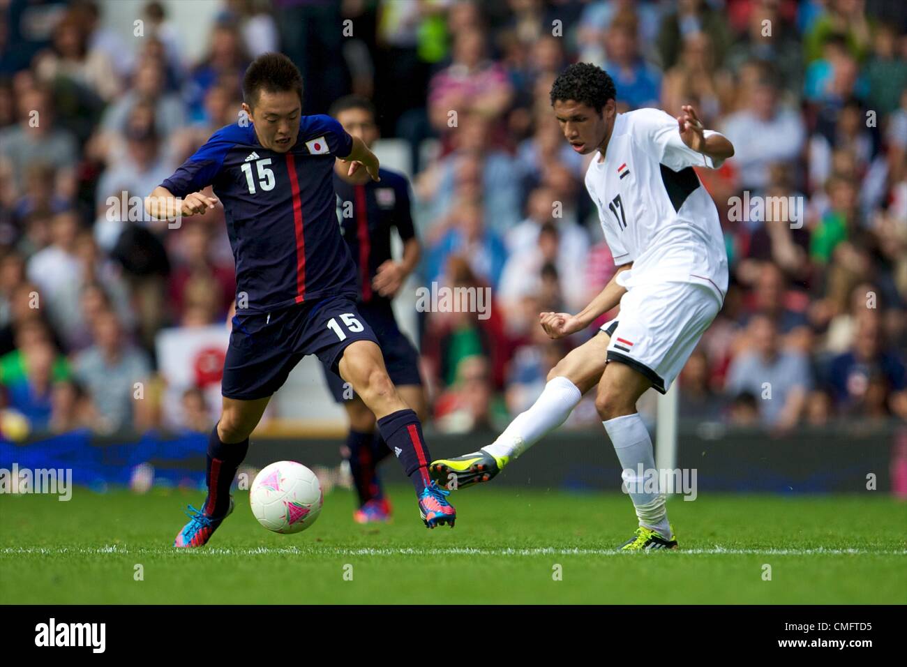 UK. 04.08.2012 Manchester, England. Egypt midfielder Mohamed El-Nenny and Japan forward Manabu Saito in action during the quarter final match between Japan and Egypt at Old Trafford. Japan won the game by a score of 3-0 to proceed to the tournament semi-finals. Stock Photo