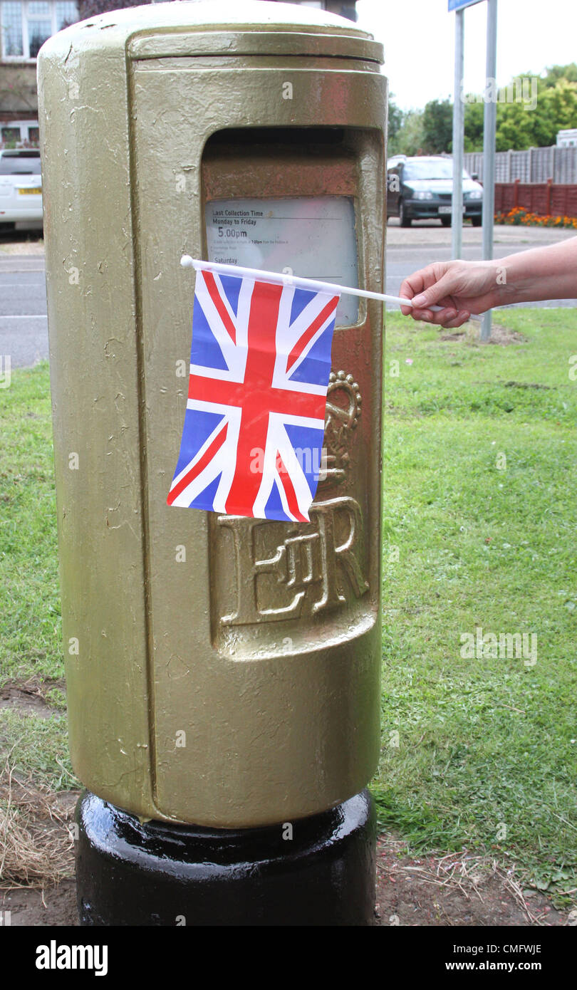 Stotfold, Bedfordshire, England - To mark Victoria Pendleton's Olympic Gold medal performance in winning the Women's Cycling Keirin, Royal Mail has painted a post box in her hometown of Stotfold, Bedfordshire, gold. In addition, to celebrate Team GB's 8th Gold Medal at the London 2012 Olympics, another stamp in Royal Mail's Gold Collection has been produced. The stamps will be on sale in over 500 Post Office branches across the UK  -  August 4th 2012  Photo by Keith Mayhew Stock Photo