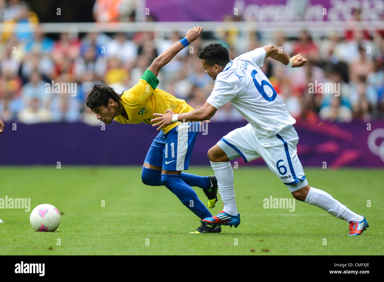 Newcastle, UK. Saturday 4th August 2012. Neymar of Brazil is chased by Arnold Peralta during the Olympic Football Men's Quarter Final game between Brazil and Honduras from St James Park. Brazil rallied to come back and win the game 3-2 and went through to the semi-final of the tournament. Stock Photo