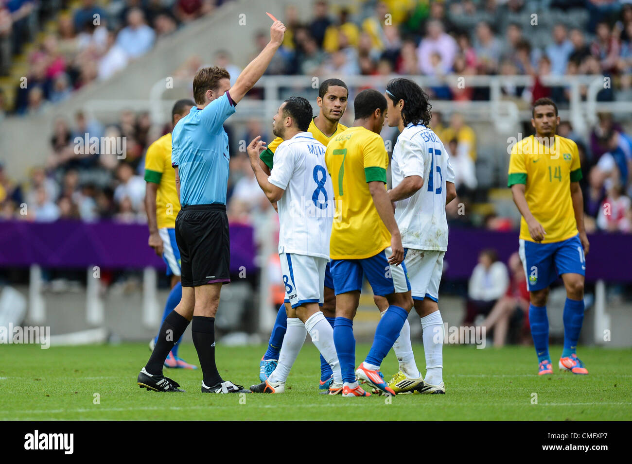 04.08.2012 Newcastle, England. Roger Espinoza of Honduras is shown the Red Card by Referee Felix Brych following his tackle on Oscar, during the Olympic Football Men's Quarter Final game between Brazil and Honduras from St James Park. Stock Photo