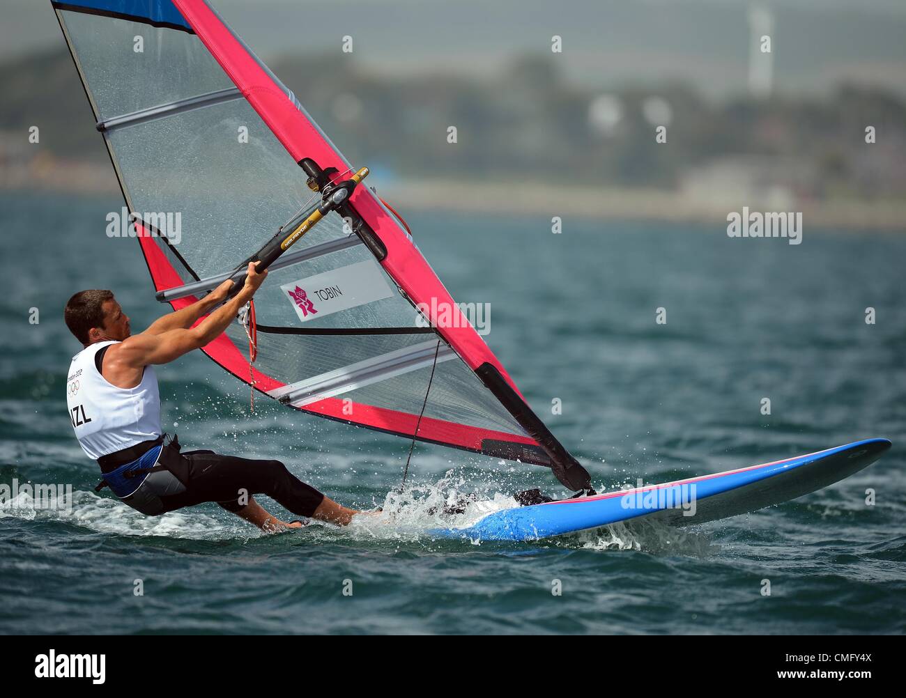 Olympic Sailing, action during the London 2012 Olympic Games at the Weymouth & Portland Venue, Dorset, Britain, UK.  Jon-Paul Tobin of New Zealand in the Men's RS:X windsurfing class race August 4th, 2012 PICTURE: DORSET MEDIA SERVICE Stock Photo